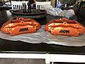 2 stage powder coat, the M logo was baked on first, then the orange, no stickers here. These are the 996 Porsche calipers